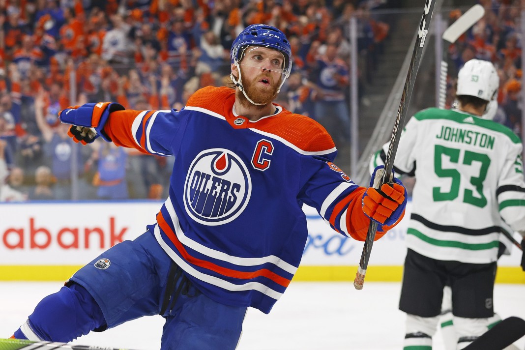 Edmonton Oilers forward Connor McDavid celebrates after scoring a goal against the Dallas Stars in the 2024 Stanley Cup Playoffs.