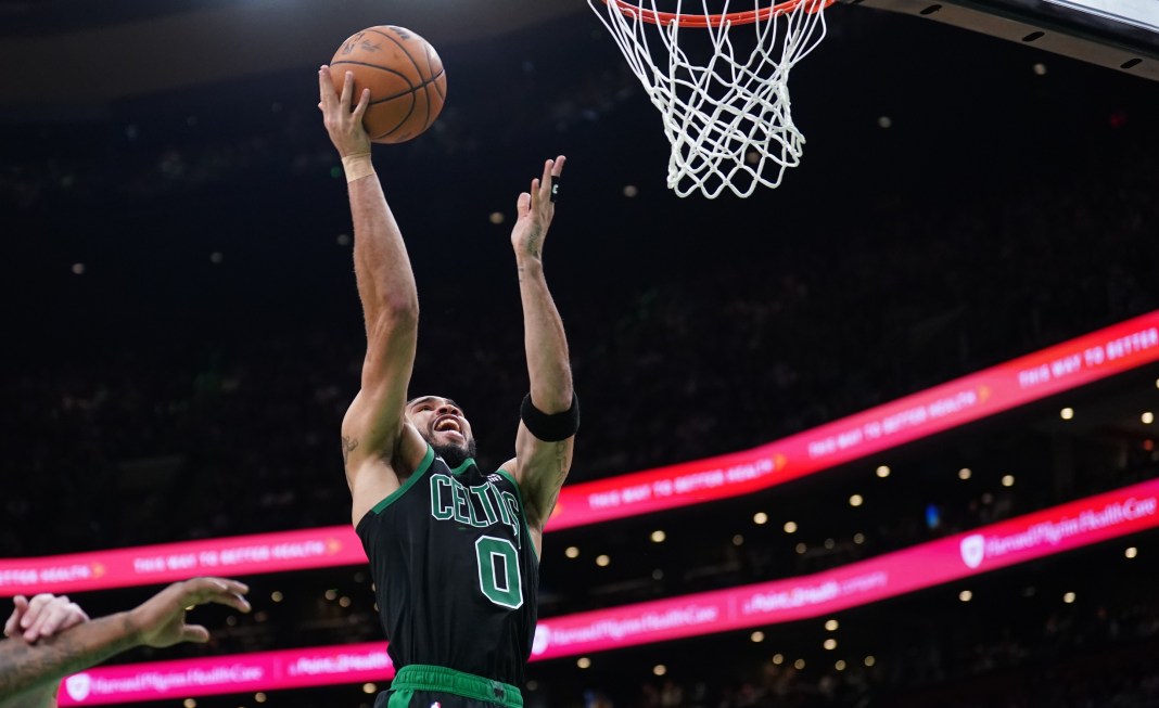 Celtics' Jayson Tatum drives to the basket against the Cavaliers in the 2024 NBA playoffs.