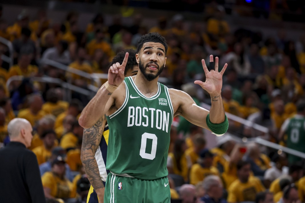 Celtics' Jayson Tatum signals a play in the 2024 NBA playoffs against the Pacers.