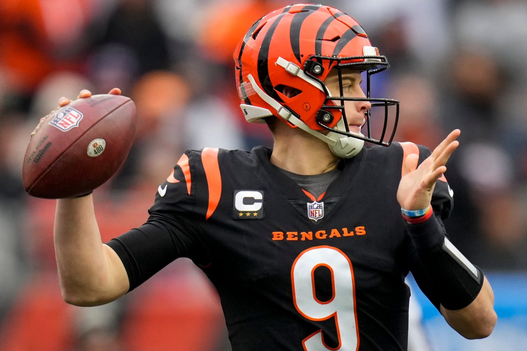 Cincinnati Bengals quarterback Joe Burrow throws a football during an NFL playoff football game.