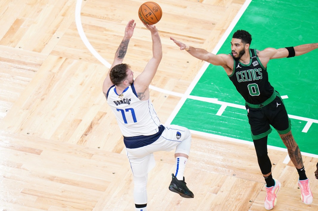 Mavericks' Luka Doncic shoots against Celtics' Jayson Tatum in the 2024 NBA Finals.