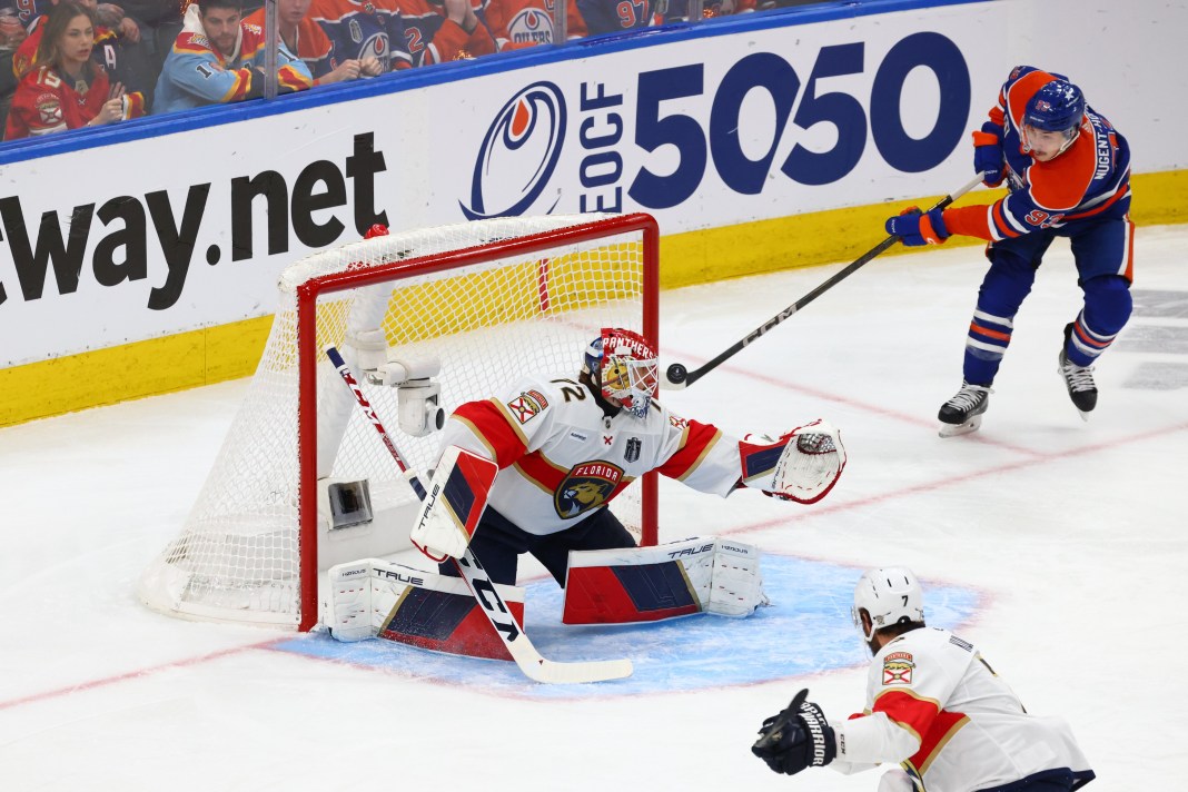 Edmonton Oilers center Ryan Nugent-Hopkins (93) plays the puck behind Florida Panthers goaltender Sergei Bobrovsky (72)