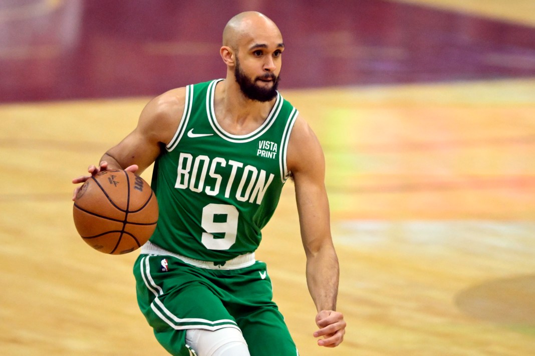 Boston Celtics guard Derrick White brings the ball up court against the Cleveland Cavaliers in game three of the 2024 NBA playoffs.