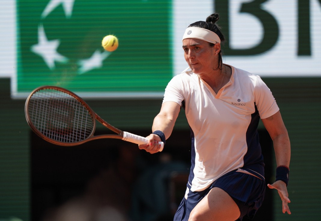 Ons Jabeur hits a forehand against Coco Gauff at the French Open.