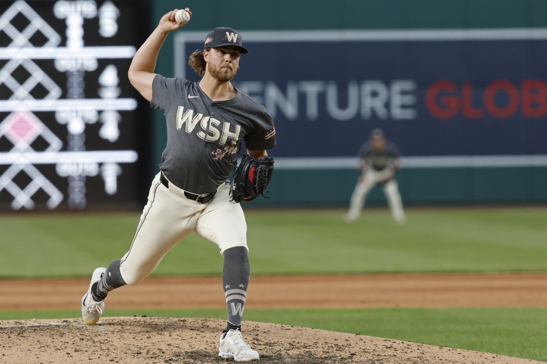 jake irvin throws a pitch