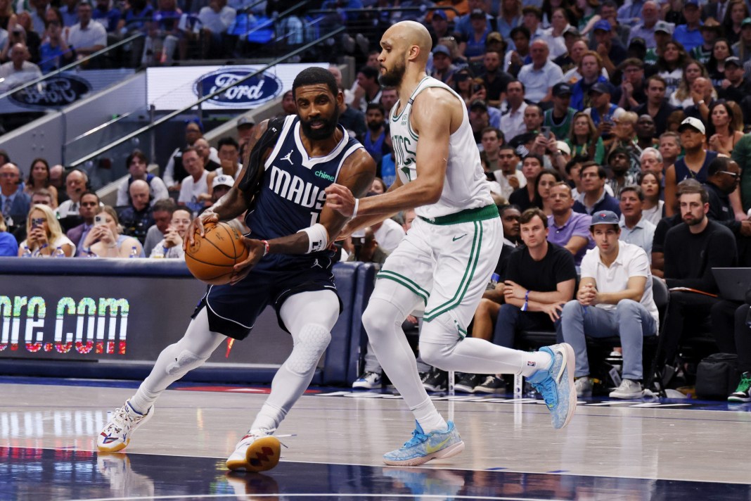 Derrick White guards Kyrie Irving in Game 4 of the NBA Finals.