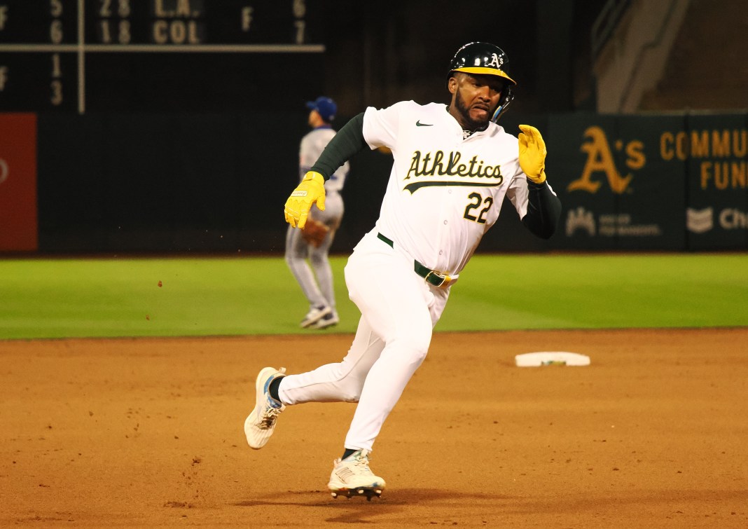 Oakland Athletics left fielder Miguel Andujar rounds third base for a run against the Kansas City Royals during the seventh inning at Oakland-Alameda County Coliseum.