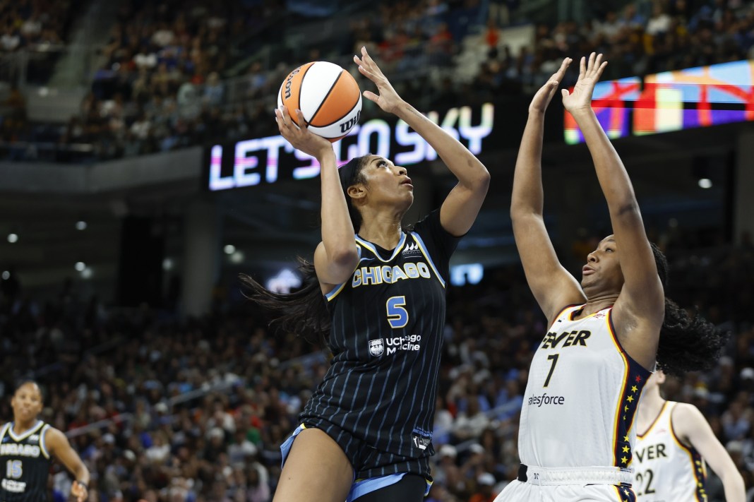 Chicago Sky forward Angel Reese (5) goes to the basket against Indiana Fever forward Aliyah Boston (7) during the second half of a basketball game at Wintrust Arena