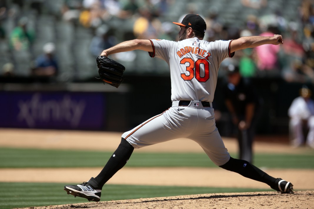 Baltimore Orioles starting pitcher Grayson Rodriguez (30) delivers a pitch against the Oakland Athletics during the fifth inning at Oakland-Alameda County Coliseum.