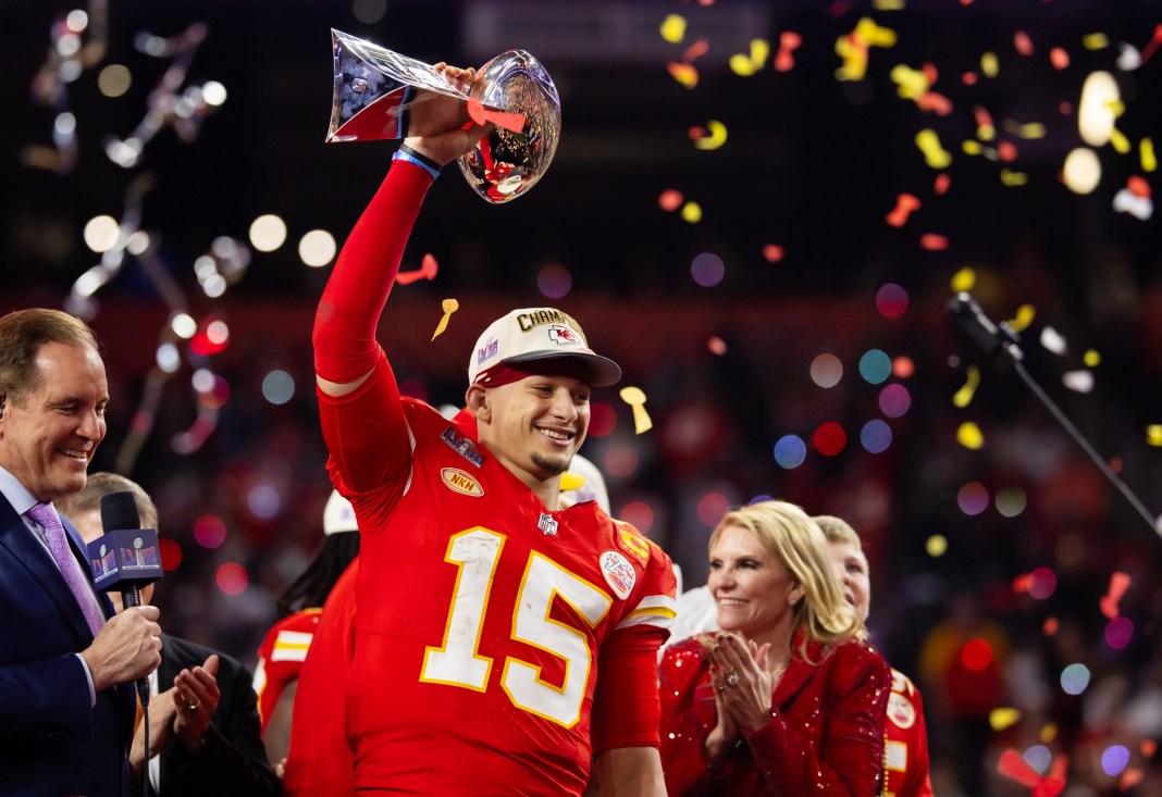 Kansas City Chiefs quarterback Patrick Mahomes (15) celebrates with the Vince Lombardi Trophy after defeating the San Francisco 49ers