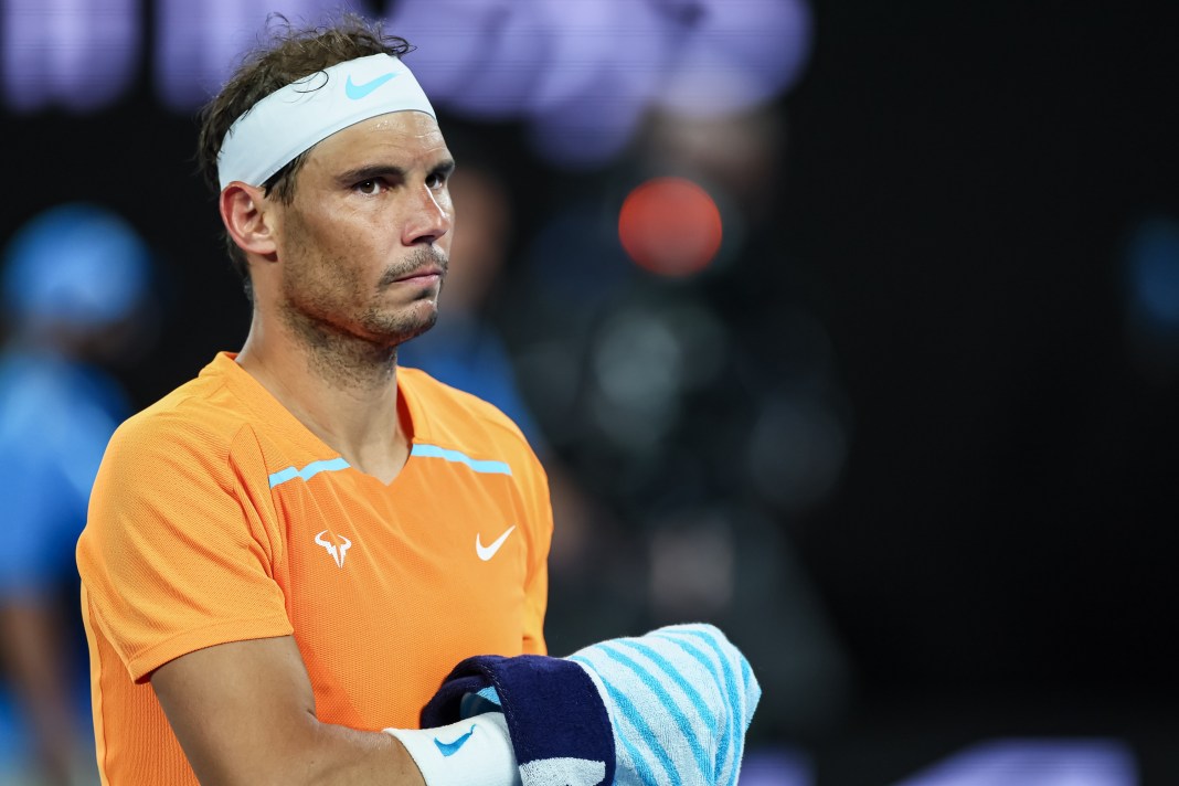 Rafael Nadal uses his towel in a match against Mackenzie McDonald at the 2023 Australian Open.