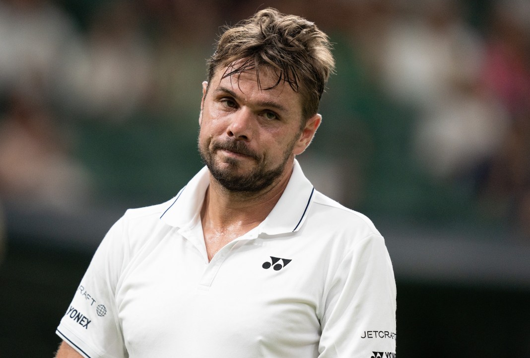 Stan Wawrinka reacts to losing a point at Wimbledon in 2023.