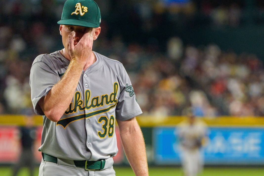 Oakland Athletics starting pitcher JP Sears (38) wipes the sweat after the end of the second inning against Arizona Diamondbacks at Chase Field