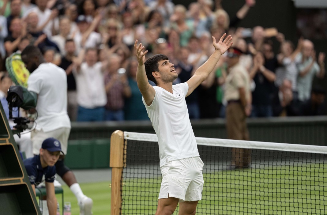 Carlos Alcaraz celebrates after his win over Frances Tiafoe at Wimbledon.