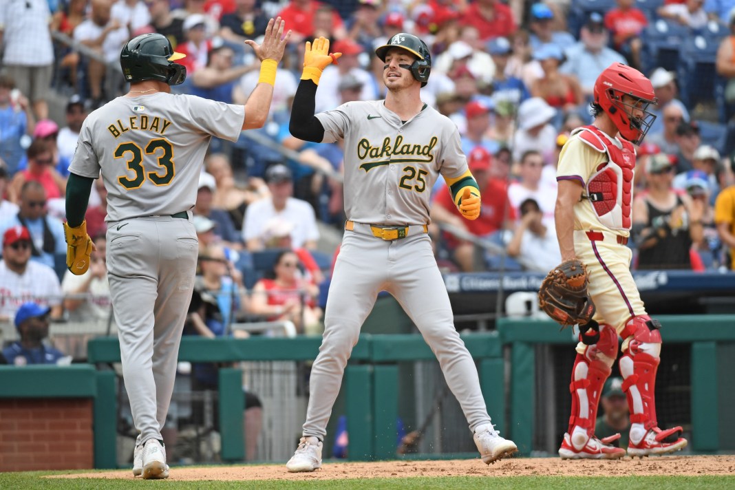 brent rooker and jj bleday of the oakland a's celebrate