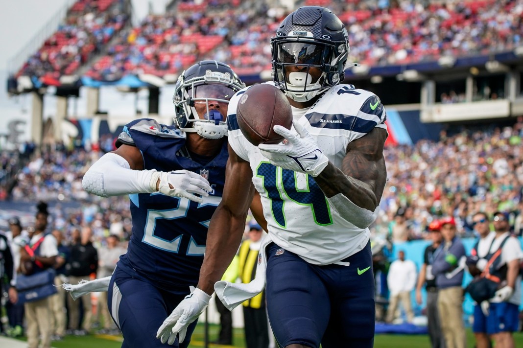 Seattle Seahawks wide receiver DK Metcalf (14) pulls in a touchdown past Tennessee Titans cornerback Tre Avery (23) during the fourth quarter at Nissan Stadium