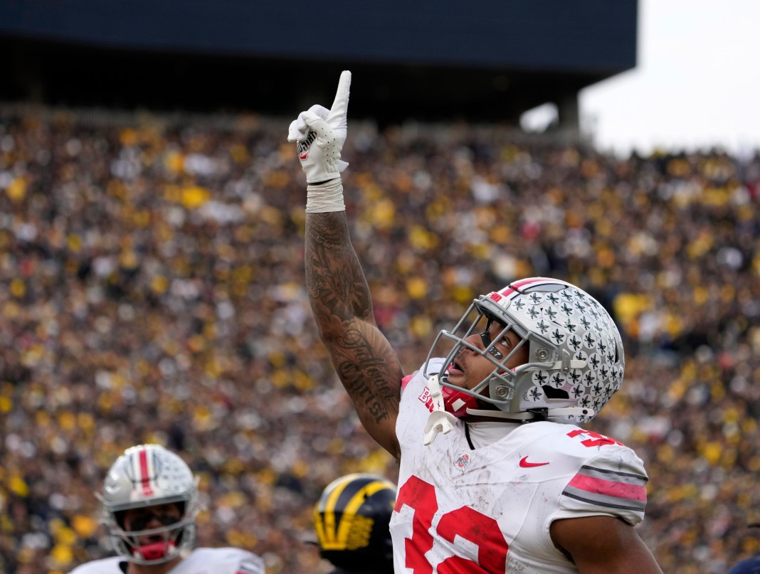 Ohio State Buckeyes running back TreVeyon Henderson (32) celebrates after scoring a touchdown during the second half of Saturday's NCAA Division I football game against the Michigan Wolverines at Michigan Stadium.