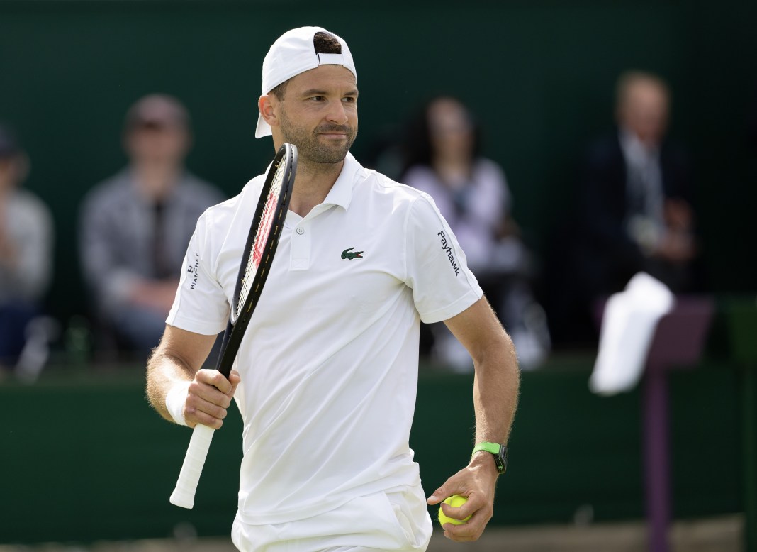 Grigor Dimitrov celebrates a big point against Juncheng Shang at Wimbledon in 2024.