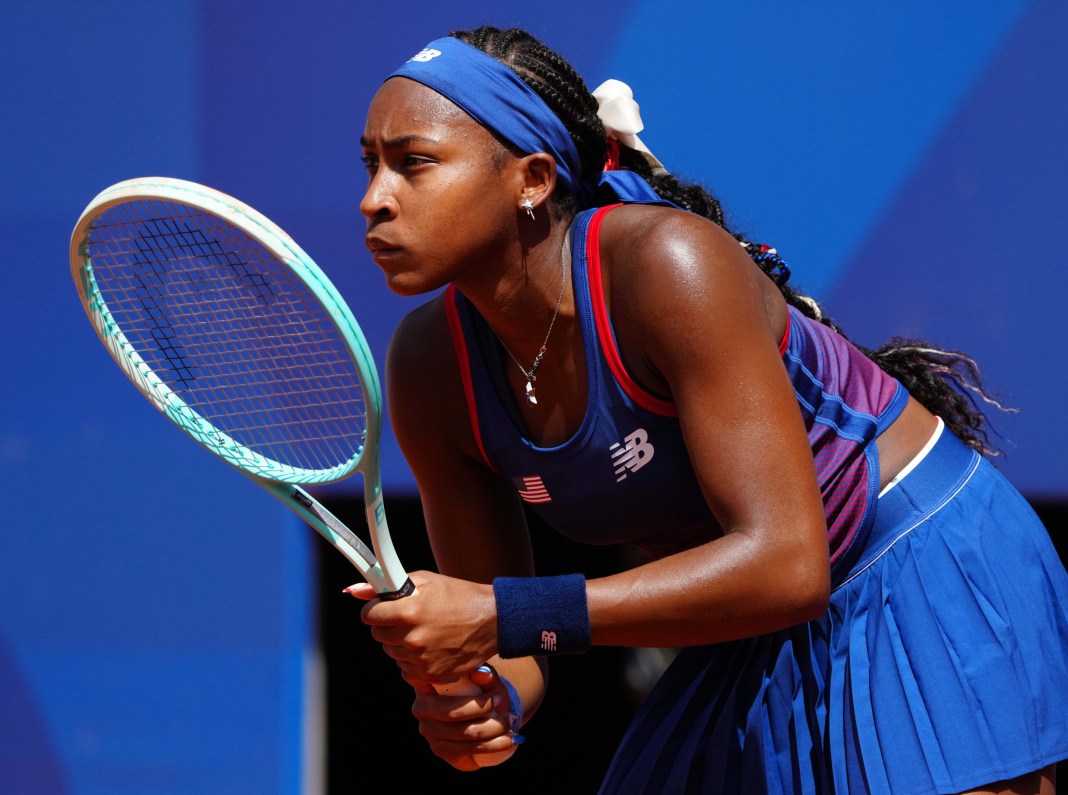 Coco Gauff gets ready to return a serve at the 2024 Paris Olympics.