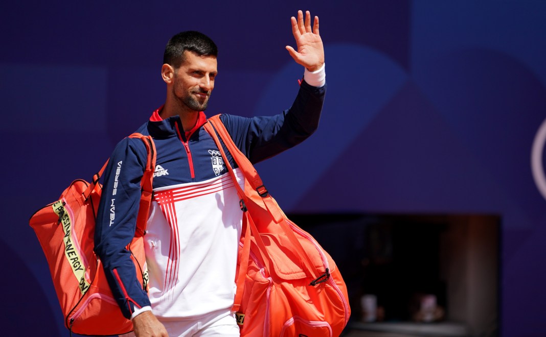 Novak Djokovic greets the fans before playing Carlos Alcaraz in the gold medal match at the 2024 Paris Olympics.