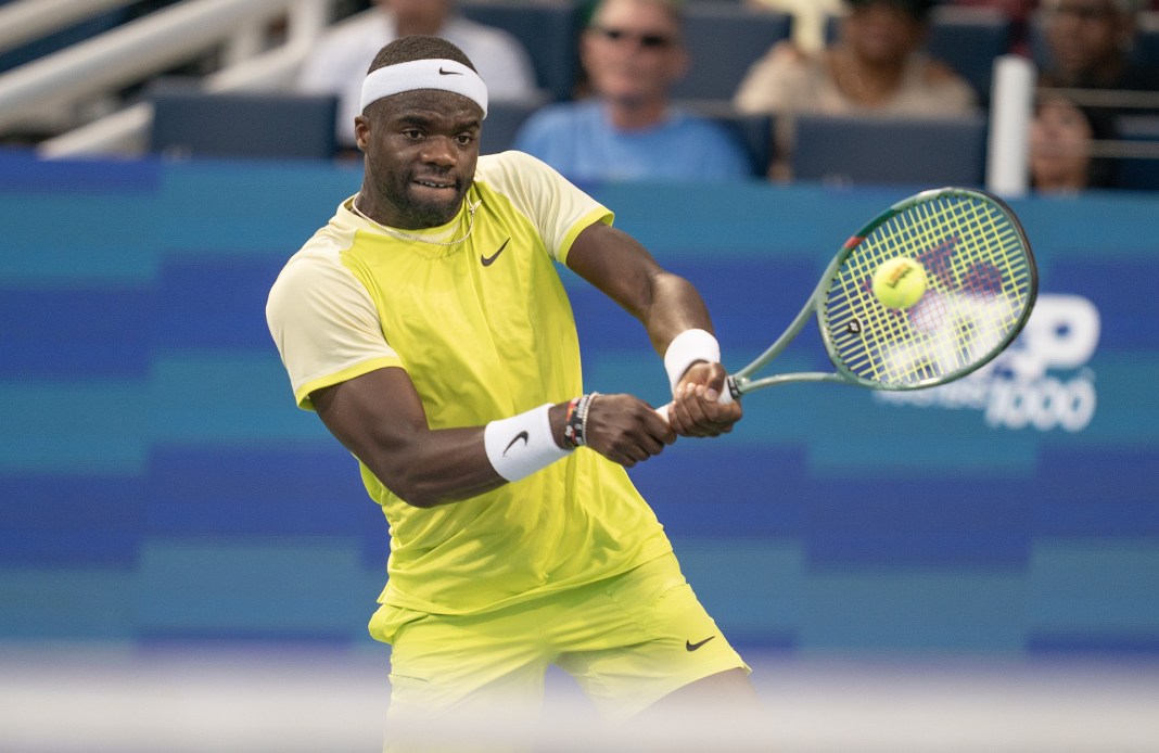 Frances Tiafoe hits a backhand in his match against Lorenzo Musetti at the Cincinnati Open.