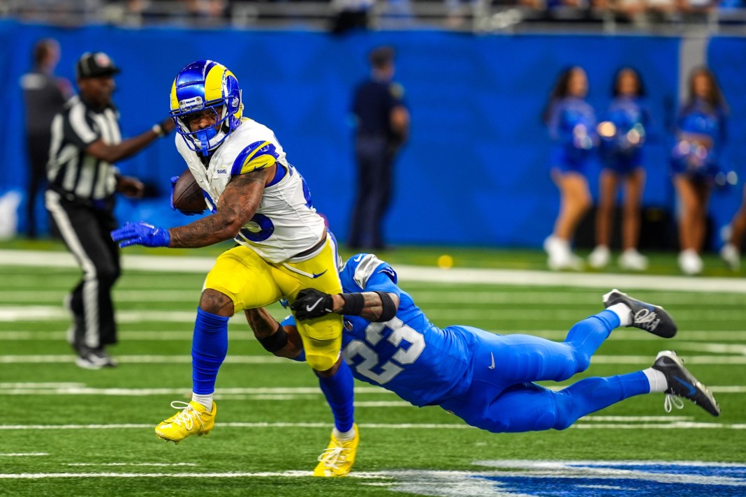 Los Angeles Rams running back Kyren Williams (23) is wrapped up by Detroit Lions cornerback Carlton Davis III (23) during the first half of the Detroit Lions season opener