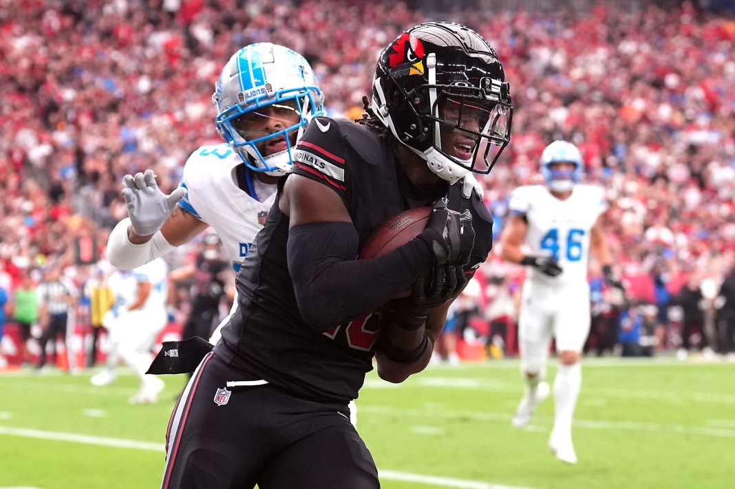 Arizona Cardinals wide receiver Marvin Harrison Jr. (18) makes a touchdown catch against Detroit Lions cornerback Carlton Davis III (23)