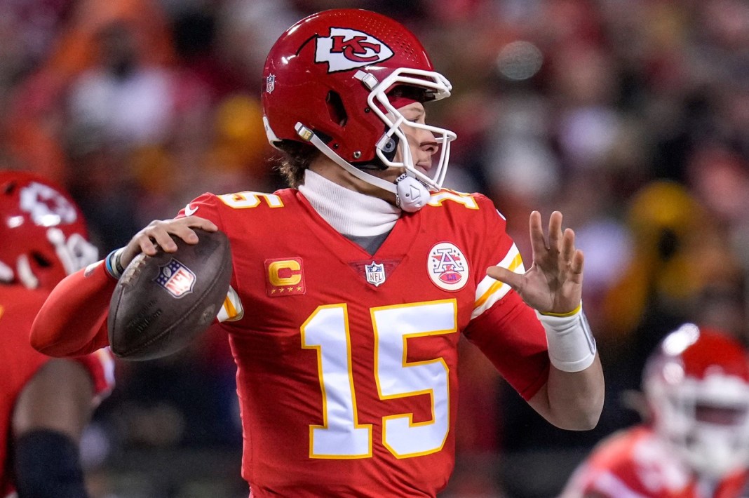 Kansas City Chiefs quarterback Patrick Mahomes (15) throws on the run in the first quarter of the AFC championship NFL game between the Cincinnati Bengals and the Kansas City Chiefs