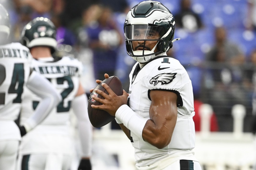 Philadelphia Eagles quarterback Jalen Hurts warms up before a preseason meeting with the Baltimore Ravens.