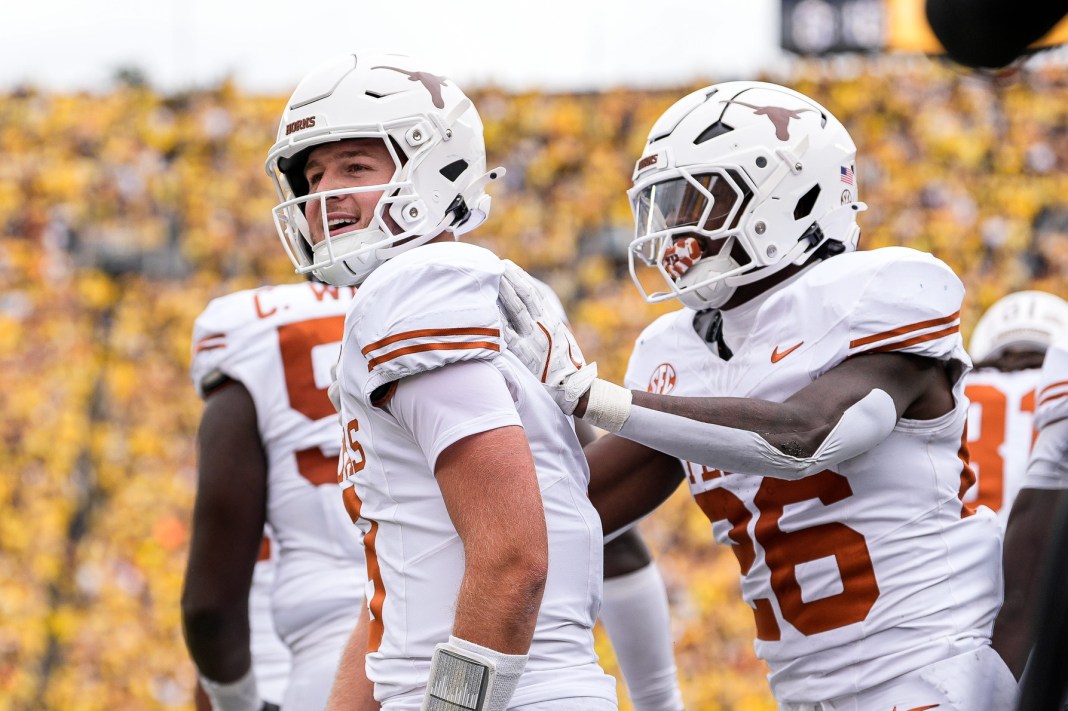 Texas quarterback Quinn Ewers celebrates a touchdown against Michigan.