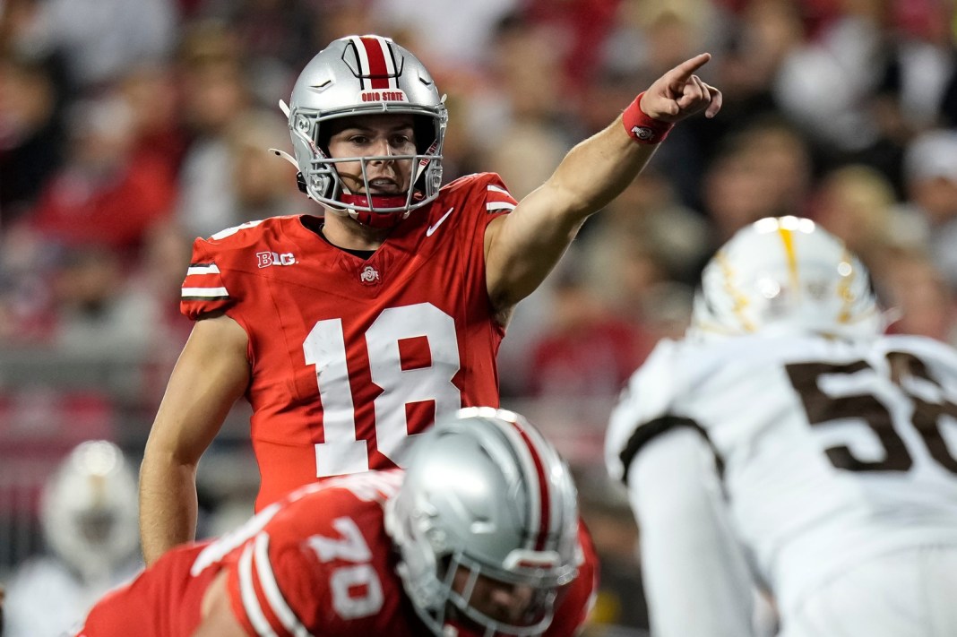 Ohio State Buckeyes quarterback Will Howard (18) motions during the second half of the NCAA football game against the Western Michigan Broncos at Ohio Stadium.