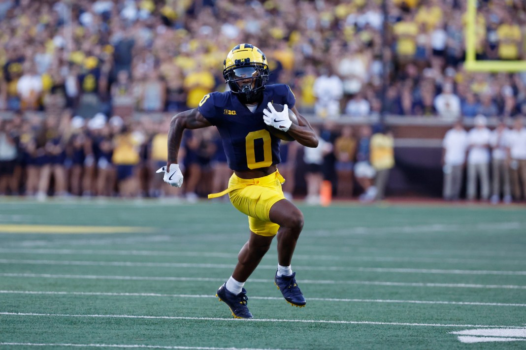 Michigan Wolverines wide receiver Semaj Morgan (0) runs the ball in the first half against the Fresno State Bulldogs at Michigan Stadium.