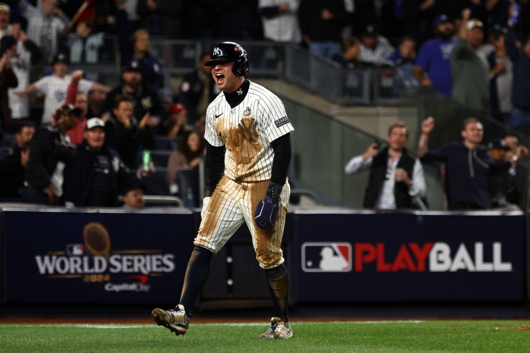 New York Yankees shortstop Anthony Volpe reacts after scoring a run against the Los Angeles Dodgers in the eighth inning during game four of the 2024 MLB World Series at Yankee Stadium.