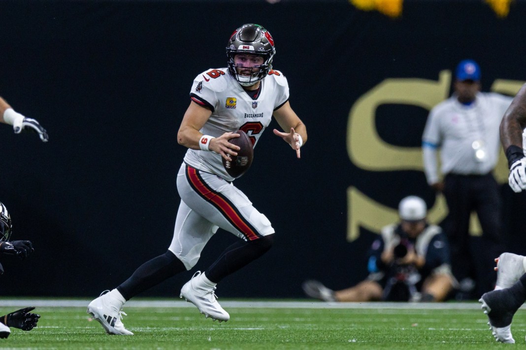 Tampa Bay Buccaneers quarterback Baker Mayfield (6) scrambles out the pocket against the New Orleans Saints during the second half at Caesars Superdome