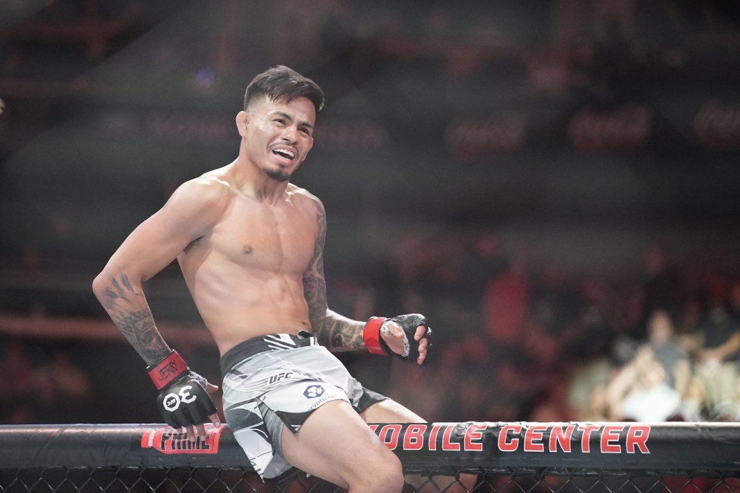 Brandon Royval (red gloves) reacts after fighting Matheus Nicolau (blue gloves) during UFC Fight Night at T-Mobile Center