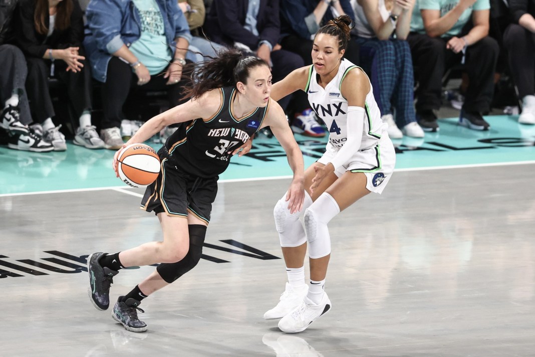 New York Liberty forward Breanna Stewart (30) looks to drive past Minnesota Lynx forward Napheesa Collier (24) in the fourth quarter during game two of the 2024 WNBA Finals