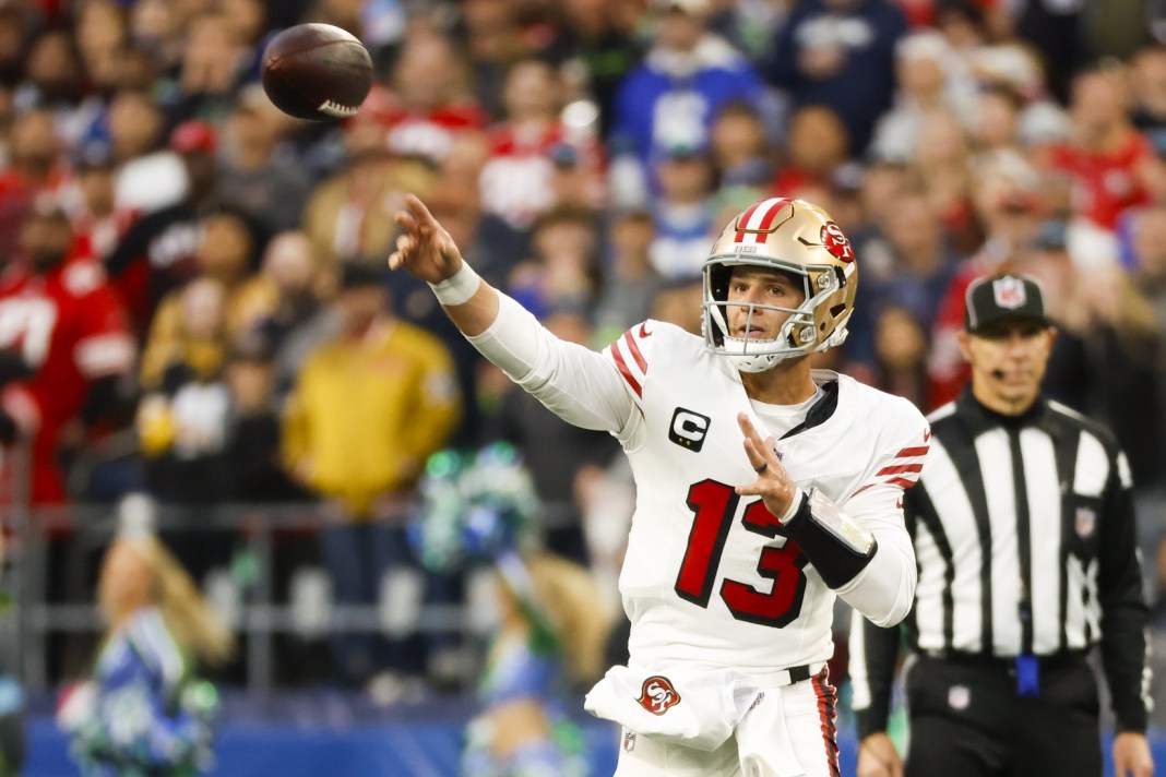 San Francisco 49ers quarterback Brock Purdy (13) passes against the Seattle Seahawks