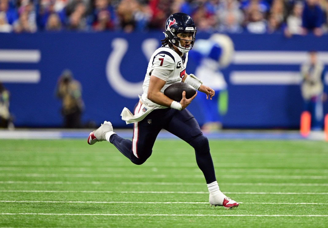 Houston Texans quarterback C.J. Stroud runs the ball against the Indianapolis Colts during the second half at Lucas Oil Stadium.