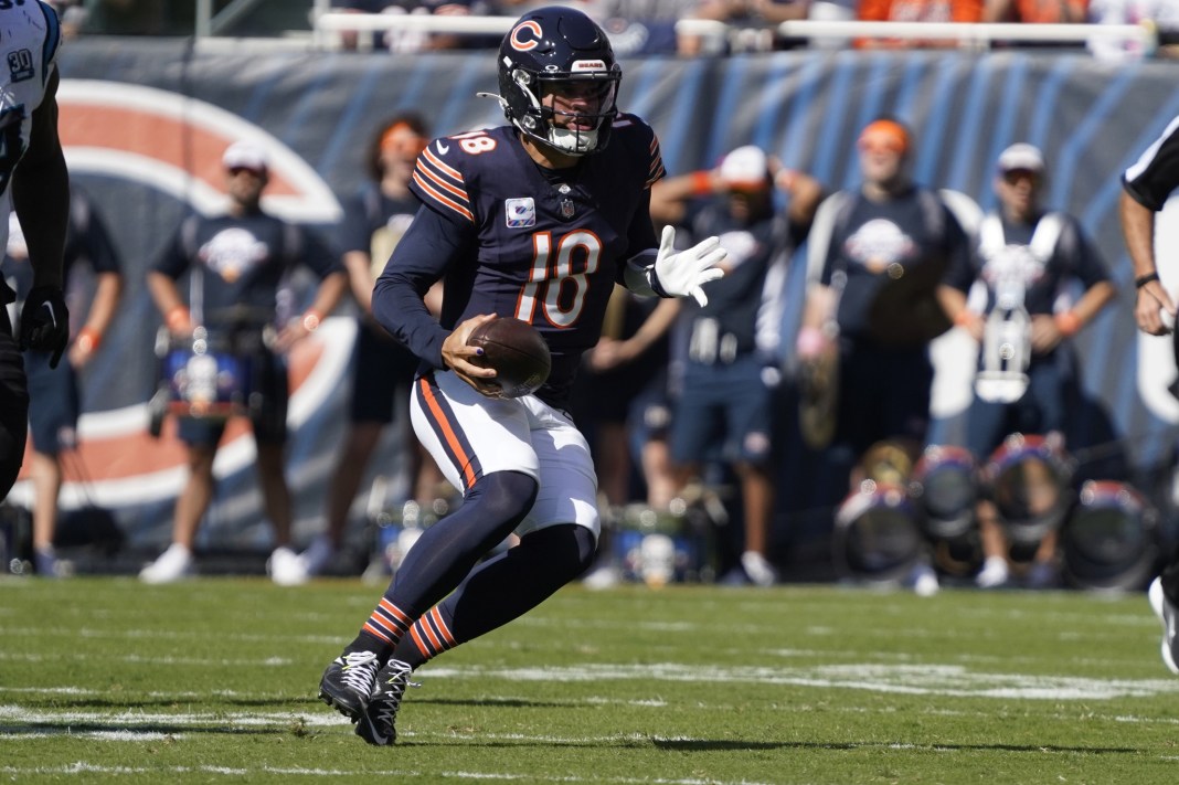 Chicago Bears quarterback Caleb Williams (18) runs against the Carolina Panthers during the second half at Soldier Field