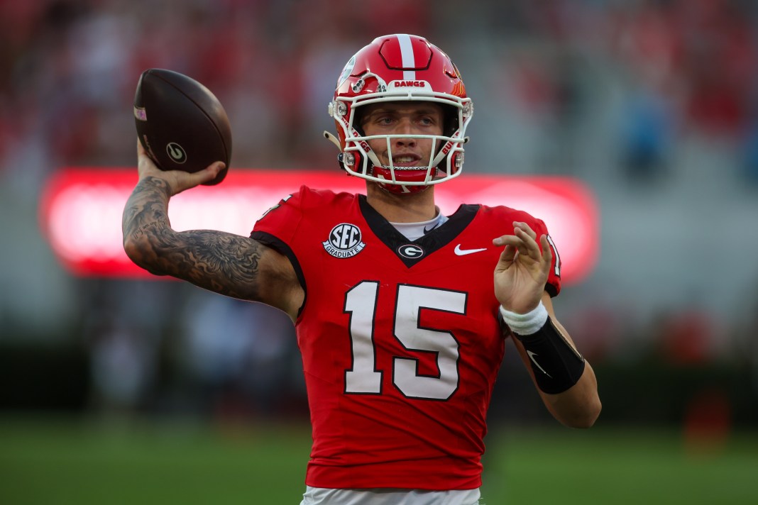 Georgia Bulldogs quarterback Carson Beck warms up against the Mississippi State Bulldogs in the third quarter at Sanford Stadium.