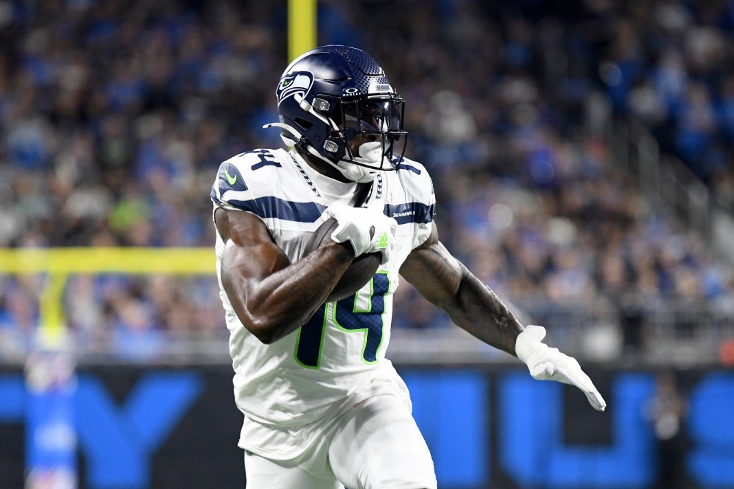 Seattle Seahawks wide receiver DK Metcalf (14) runs with the ball against the Detroit Lions in the second quarter at Ford Field