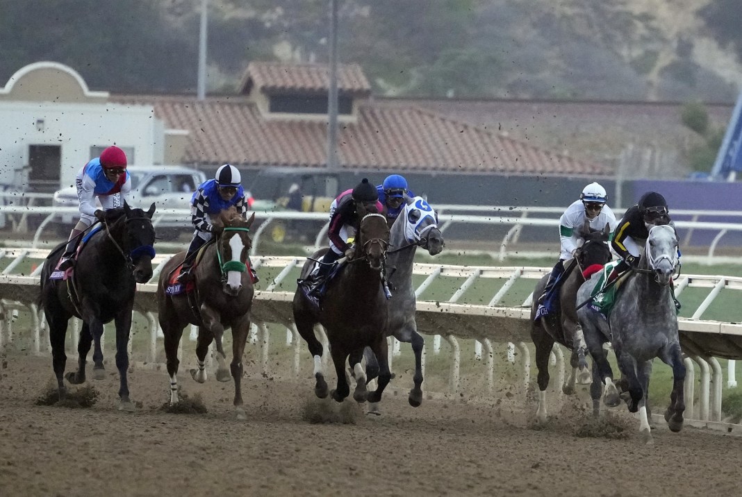 Entries in the Breeders’ Cup Classic run toward the first turn during the Breeders’ Cup World Championships at Del Mar Race Track.