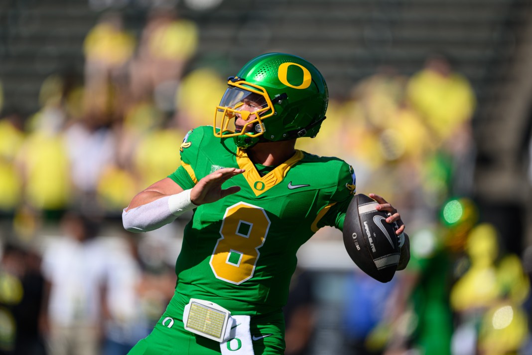 Oregon Ducks quarterback Dillon Gabriel (8) throws a pass warming up before the game against the Idaho Vandals