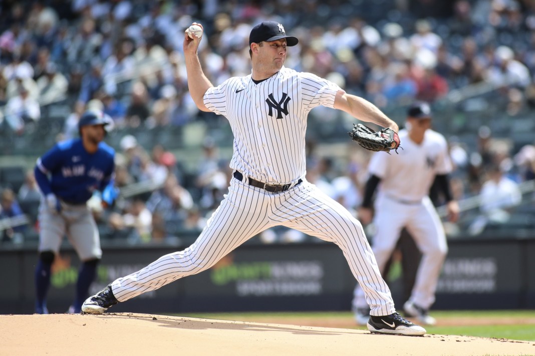 New York Yankees starting pitcher Gerrit Cole (45) pitches in the first inning against the Toronto Blue Jays at Yankee Stadium