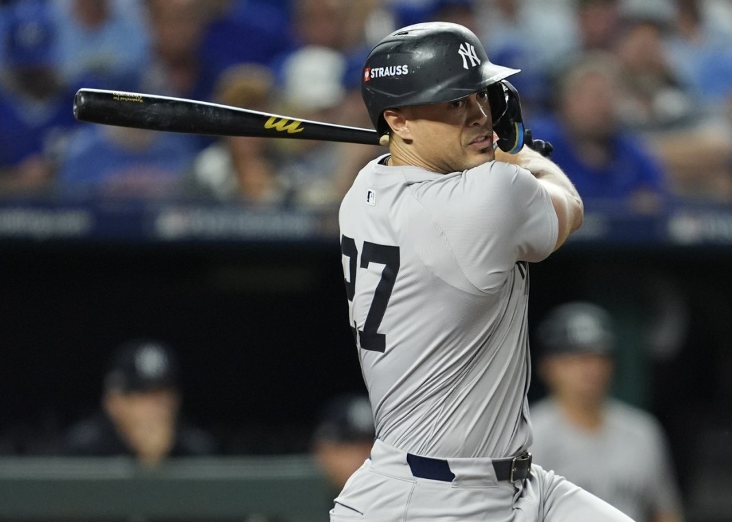 New York Yankees designated hitter Giancarlo Stanton (27) hits a double during the second inning against the Kansas City Royals