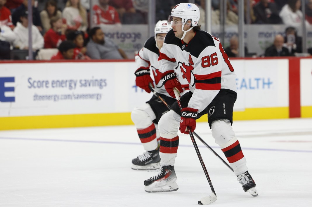 New Jersey Devils center Jack Hughes skates with the puck in the first period against the Detroit Red Wings at Little Caesars Arena.