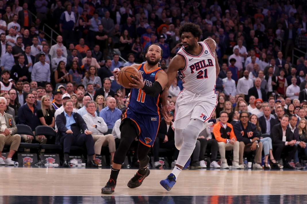 New York Knicks guard Jalen Brunson (11) drives to the basket against Philadelphia 76ers center Joel Embiid (21)