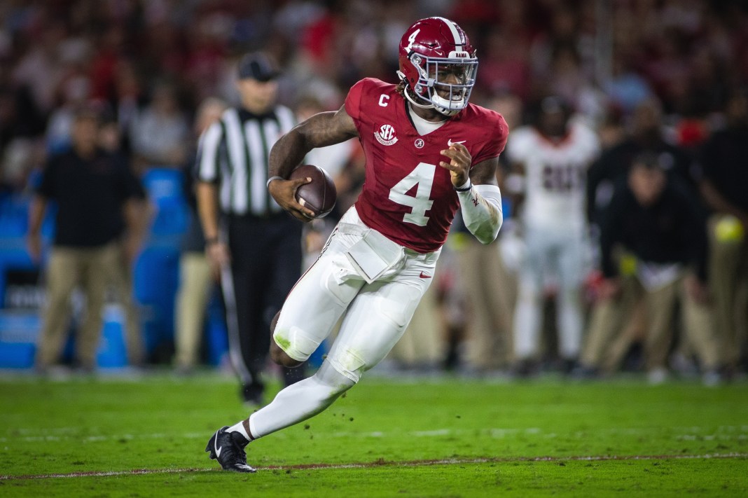 Alabama Crimson Tide quarterback Jalen Milroe (4) runs against the Georgia Bulldogs