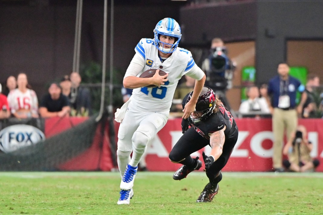 Detroit Lions quarterback Jared Goff (16)runs for a first down as Arizona Cardinals linebacker Dennis Gardeck (45) pursues