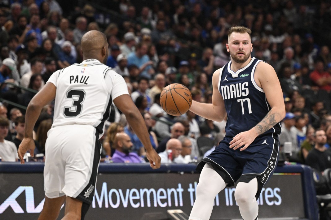 San Antonio Spurs guard Chris Paul (3) and Dallas Mavericks guard Luka Doncic (77) in action